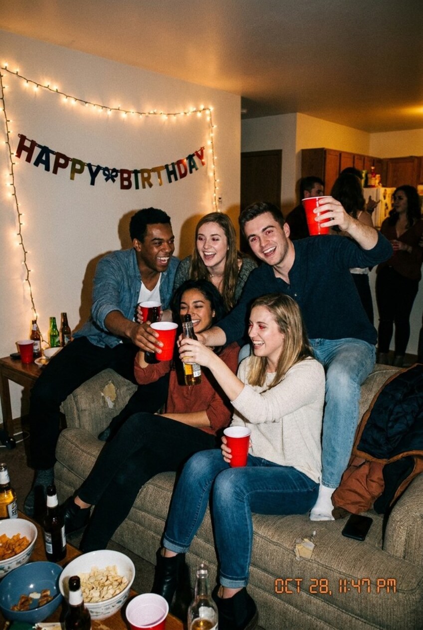 Before — five friends on a living-room sofa at a birthday party